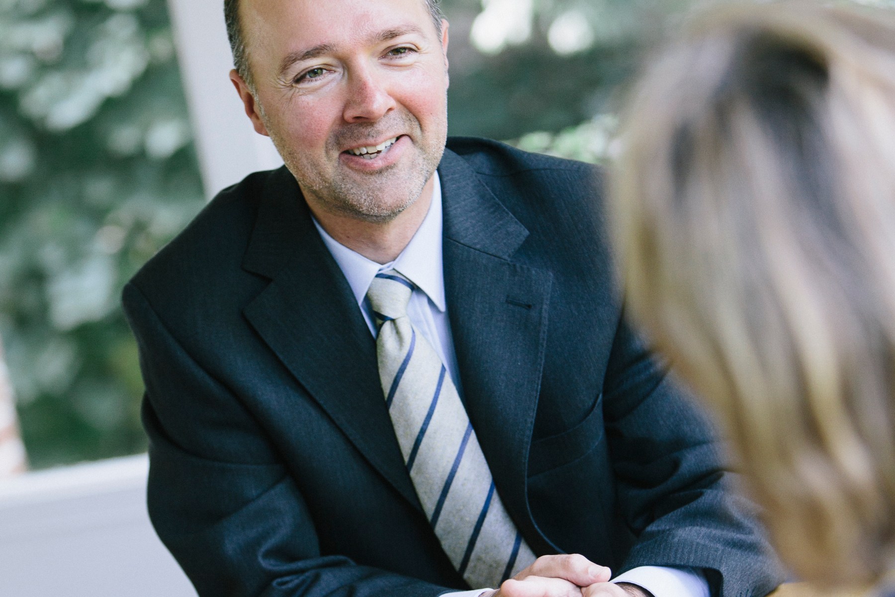 Aad Boot interviewed at a wooden table